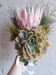 Cluster of dessert rose and protea